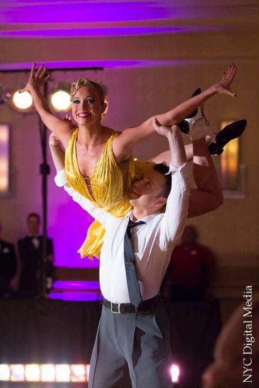 Slawomir Roszak performing a lift in a show dance